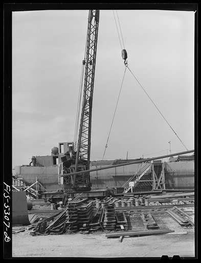 Untitled photo, possibly related to: Decatur, Alabama. Ingalls Shipbuilding Company. A section of one of the sides of the stern of a barge being lowered into place