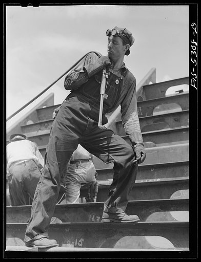Decatur, Alabama. Ingalls Shipbuilding Company. A tacker working on one of the barges