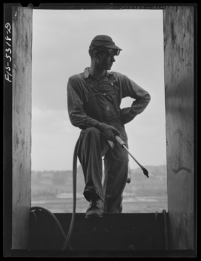 Decatur, Alabama. Ingalls Shipbuilding Company. A young tacker working on one of the barges