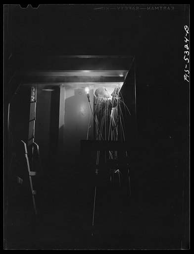 Untitled photo, possibly related to: Decatur, Alabama. Ingalls Shipbuilding Company. A welder working on the bulkhead of a barge under construction
