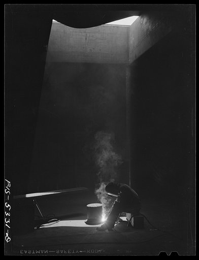 Decatur, Alabama. Ingalls Shipbuilding Company. A welder working in the bottom on one of the barges