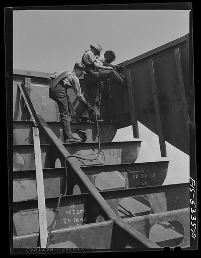 Decatur, Alabama. Ingalls Shipbuilding Company. A section of one of the sides of the stern of a barge being lowered into place