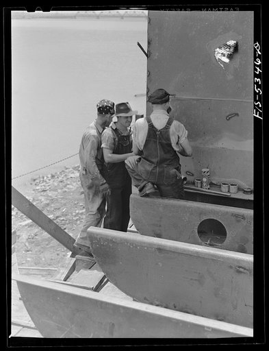 Untitled photo, possibly related to: Decatur, Alabama. Ingalls Shipbuilding Company. Pipe fitters at work on a barge