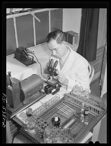 Brooklyn, New York. New York state industrial hygiene physician working with a portable laboratory in a factory