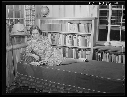 Yonkers, New York. Mrs. Garrity reading on the porch