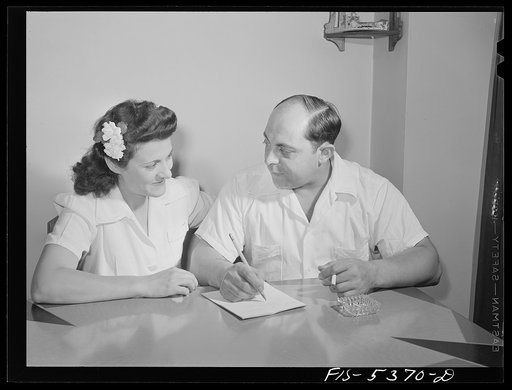 Brooklyn, New York. Red Hook housing development. Mr. and Mrs. Caputo planning their budgets