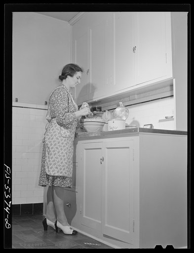 Yonkers, New York. Mrs. Garrity, suburban housewife, in the kitchen preparing dinner