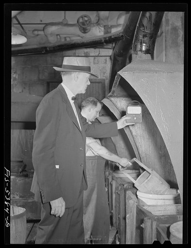 Brooklyn, New York. Ventilating engineer testing safety devices in a factory