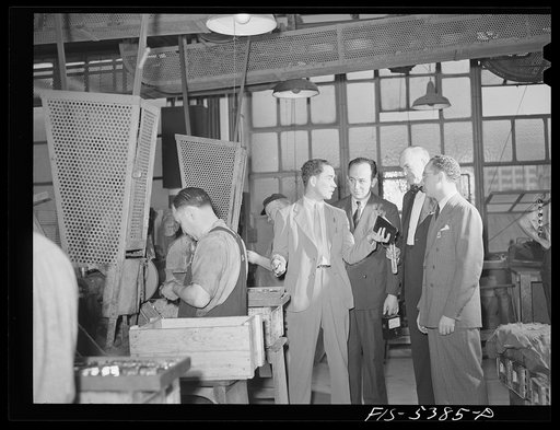 Brooklyn, New York. Industrial hygiene crew including the doctor, chemist and a ventilating engineer discussing safety precautions with a factory representative