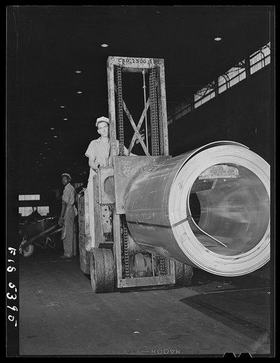 Sheffield, Alabama. Reynolds Alloys Company. Specially constructed dollies carry aluminum rolls around the plant