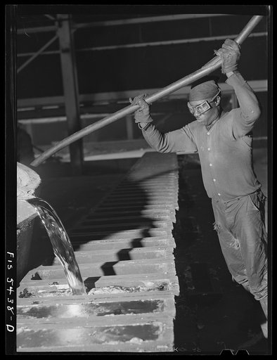 Sheffield, Alabama. Reynolds Metal Company. Pouring aluminum into pig molds at the cast house