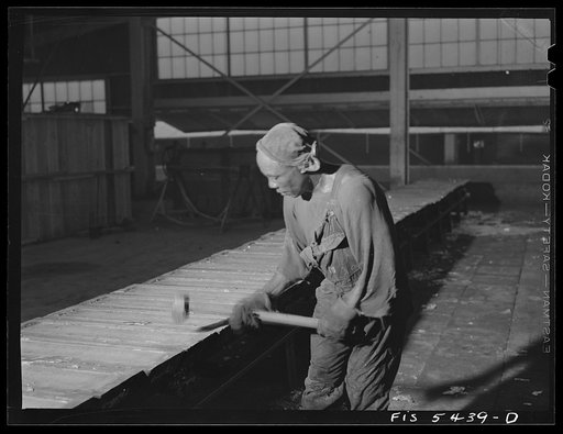Untitled photo, possibly related to: Sheffield, Alabama. Reynolds Metal Company. Pouring aluminum into pig molds at the cast house