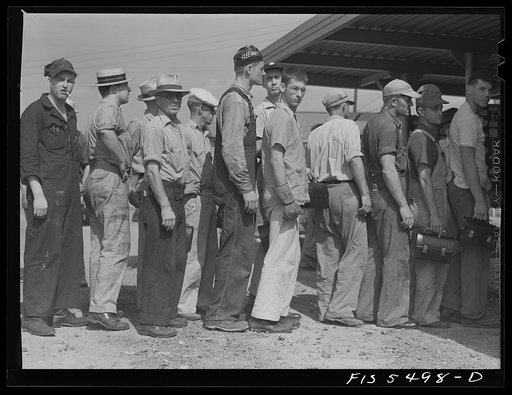 Sheffield, Alabama. Reynolds Alloys Company. Workmen checking out at end of a day's shift