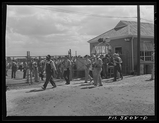 Sheffield, Alabama. Reynolds Alloys Company. Workmen entering gate during change of shifts