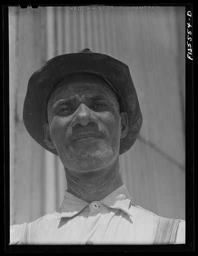 Sheffield, Alabama. Reynolds Metal Company. Workman in reduction plant. The white powder on his face is alumina