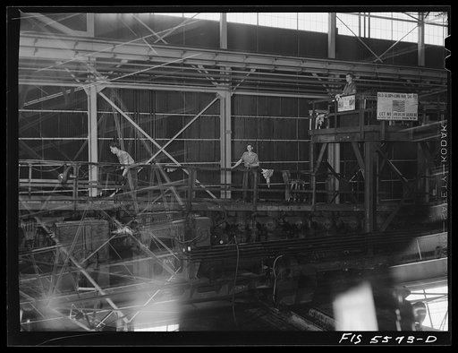 Untitled photo, possibly related to: Sheffield, Alabama. Reynolds Alloys Company. On the tilt-table in the structural mill