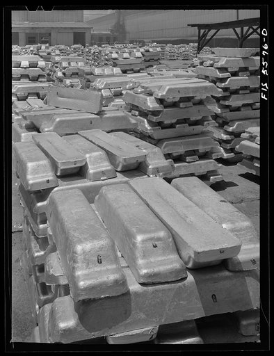 Untitled photo, possibly related to: Sheffield, Alabama. Reynolds Metal Company. Aluminum pigs in the yard