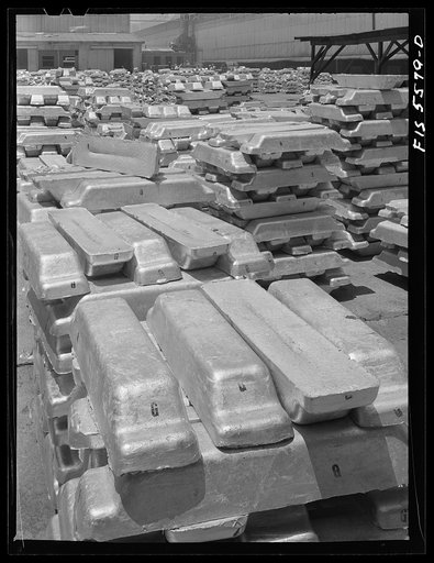 Untitled photo, possibly related to: Sheffield, Alabama. Reynolds Metal Company. Aluminum pigs in the yard