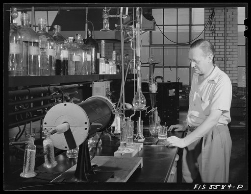 Sheffield, Alabama. Reynolds Metal Company. Mr. Giles, research director, with apparatus for determining the amount of pure aluminum in various oxides produced during the process of producing aluminum pigs