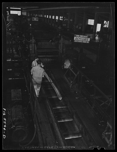 Untitled photo, possibly related to: Sheffield, Alabama. Reynolds Alloys Company. Rolling aluminum rob on the tilt-table in the structural mill