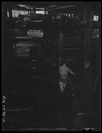 Untitled photo, possibly related to: Sheffield, Alabama. Reynolds Alloys Company. Rolling aluminum rod on the tilt-table in the structural mill