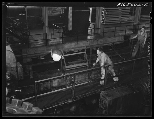 Sheffield, Alabama. Reynolds Alloys Company. On the tilt-table of a rolling machine in the structural mill