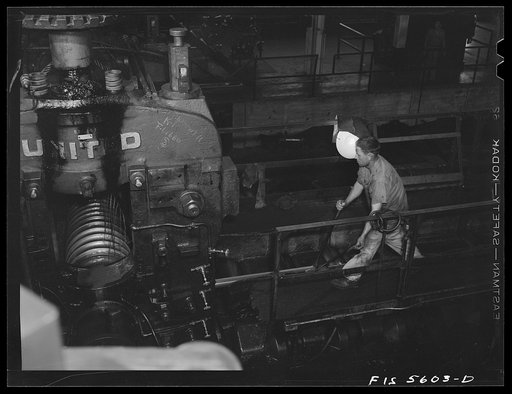 Untitled photo, possibly related to: Sheffield, Alabama. Reynolds Alloys Company. On the tilt-table of a rolling machine in the structural mill
