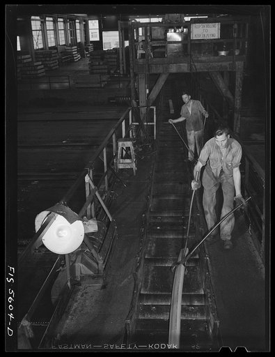 Sheffield, Alabama. Reynolds Alloys Company. On the tilt-table of a rolling machine in the structural mill