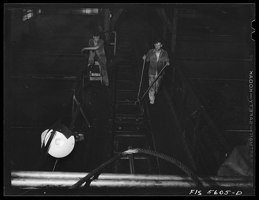 Untitled photo, possibly related to: Sheffield, Alabama. Reynolds Alloys Company. On the tilt-table of a rolling machine in the structural mill