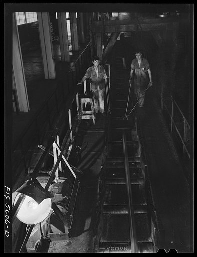Untitled photo, possibly related to: Sheffield, Alabama. Reynolds Alloys Company. On the tilt-table of a rolling machine in the structural mill