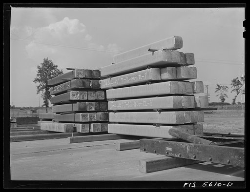 Sheffield, Alabama. Reynolds Alloys Company. Ingots such as these are turned into long rods at the structural mill