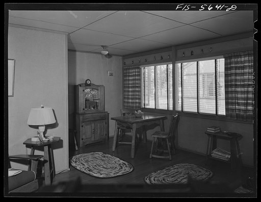 Untitled photo, possibly related to: Middle River, Maryland. Housing development for workers at the Glenn L. Martin aircraft plant. Another arrangement of furniture in the living room and dining alcove