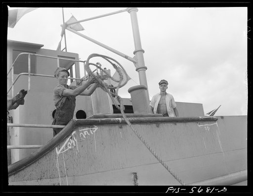 Ingalls Shipbuilding Company, Decatur, Alabama. Catching a line thrown to an Army barge