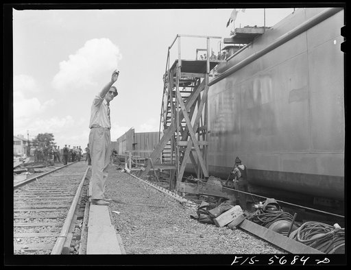 Ingalls Shipbuilding Company, Decatur, Alabama. Signaling to let go an Army barge and launch her