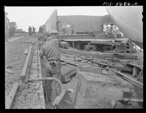 Ingalls Shipbuilding Company, Decatur, Alabama. Knocking out a pin to let go an Army barge and launch her