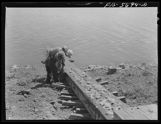 Ingalls Shipbuilding Company, Decatur, Alabama. Greasing the ways to launch an Army barge