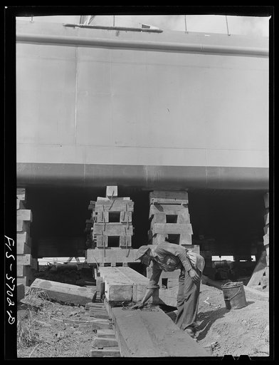 Ingalls Shipbuilding Company. Decatur, Alabama. Greasing the ways to launch an Army barge