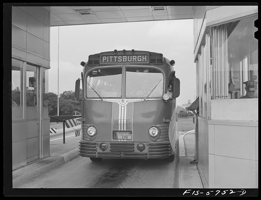 Pennsylvania Turnpike, Pennsylvania. Westbound bus at a toll booth