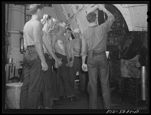 Hoffman Island, merchant marine training center off Staten Island, New York. Instructor with group of trainees in the engine room of the training ship New York
