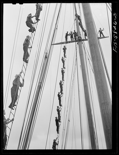 Untitled photo, possibly related to: Hoffman Island, merchant marine training center off Staten Island, New York. Trainees climbing to the tops of the schooner Vema on which they have a month's training period
