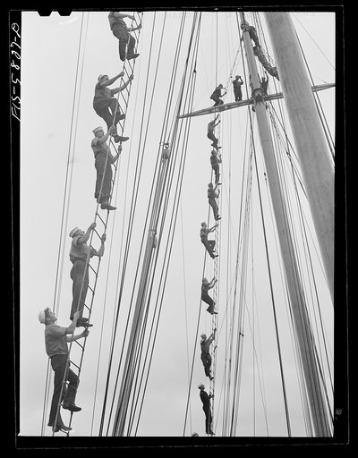 Hoffman Island, merchant marine training center off Staten Island, New York. Trainees climbing to the tops of the schooner Vema on which they have a month's training period