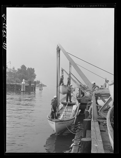 Hoffman Island, merchant marine training center off Staten Island, New York. Lowering life boats for drill