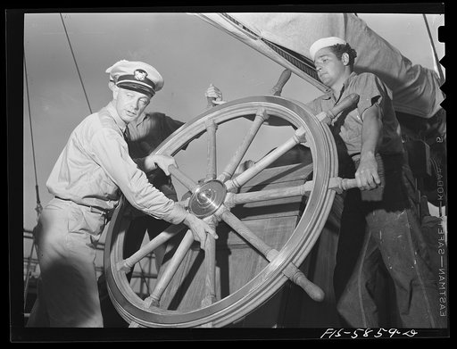 Untitled photo, possibly related to: Hoffman Island, merchant marine training center off Staten Island, New York. Mr. Stone instructing trainee at wheel of the schooner Vema