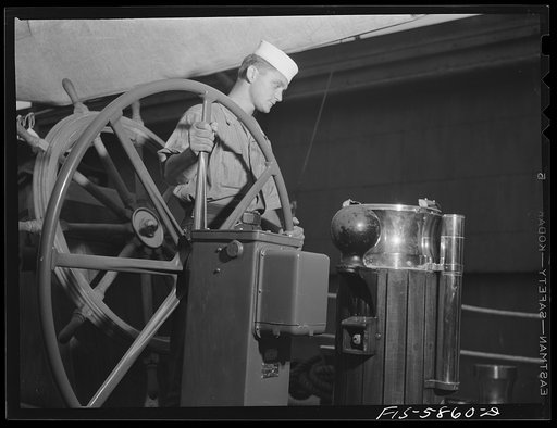 Hoffman Island, merchant marine training center off Staten Island, New York. Trainee at wheel of schooner Vema