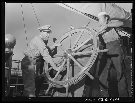 Hoffman Island, merchant marine training center off Staten Island, New York. Mr. Stone instructing trainee at wheel of the schooner Vema