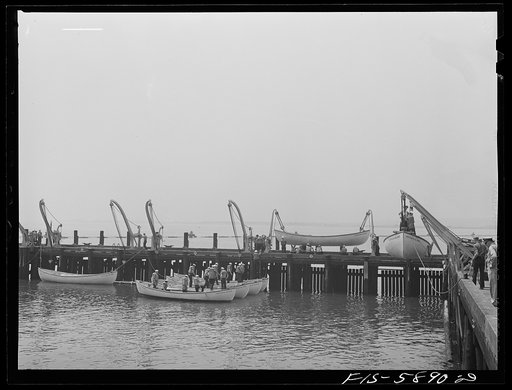 Hoffman Island, merchant marine training center off Staten Island, New York. Lowering the life boats for drill
