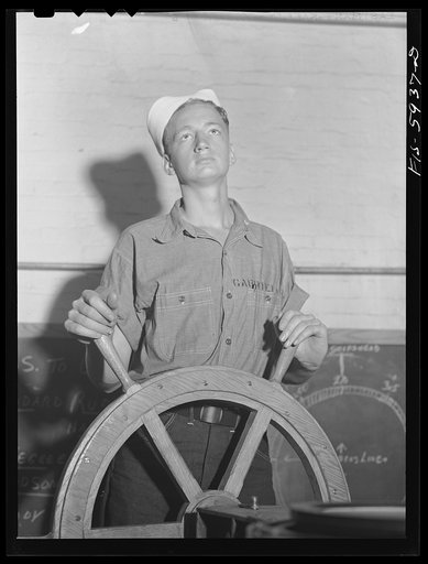 Hoffman Island, merchant marine training center off Staten Island, New York. Trainee at ship's wheel in the class