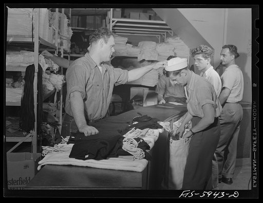 Hoffman Island, merchant marine training center off Staten Island, New York. New arrivals waiting to be issued clothing