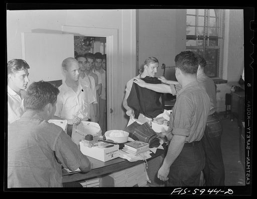 Hoffman Island, merchant marine training center off Staten Island, New York. New arrivals getting clothing and other equipment issued to them the first day