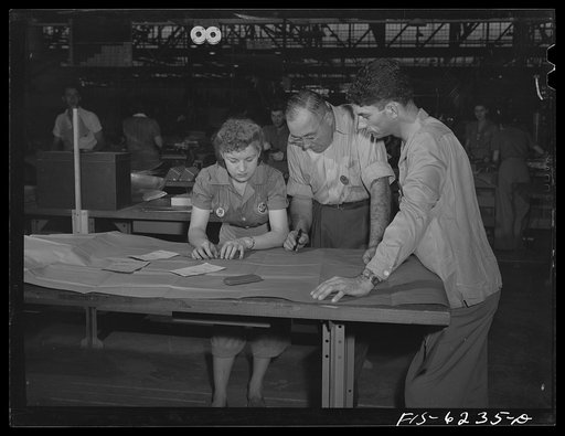 Nashville Tennessee. Discussing blueprints in the parts division. Vultee Aircraft Corporation plant